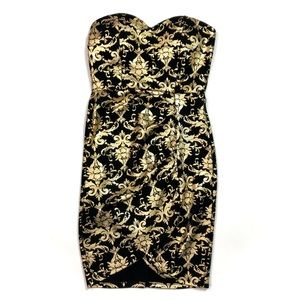 Black and gold strapless mini dress.
